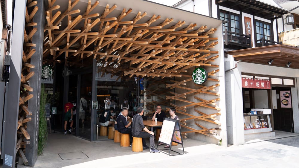 Starbucks Coffee Dazaifu Tenmangu Omotesando store featuring famous interlocking wooden beams designed by Kengo Kuma